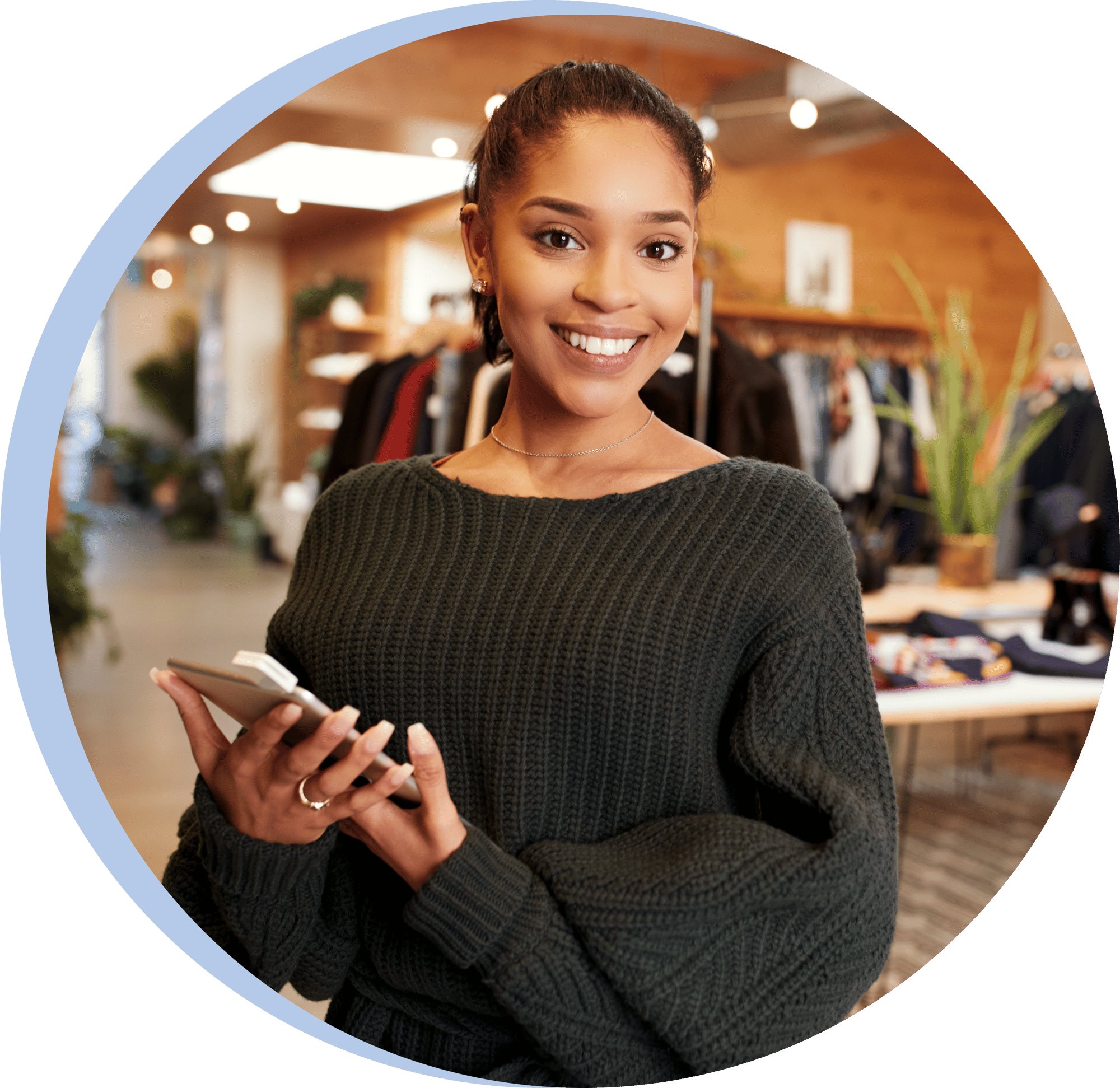 Smiling retail store associate holding a tablet Smiling retail store associate holding a tablet